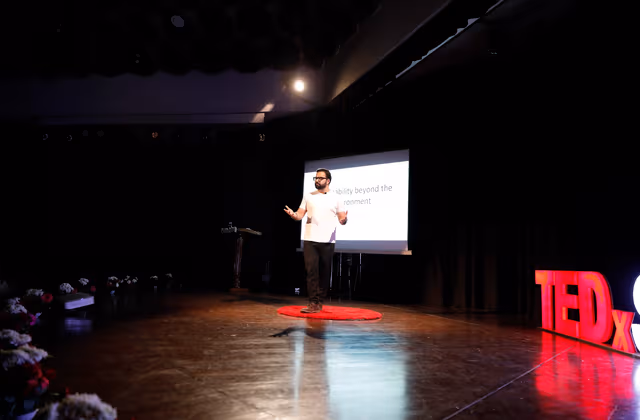 Nishkarsh speaking at TEDx stage